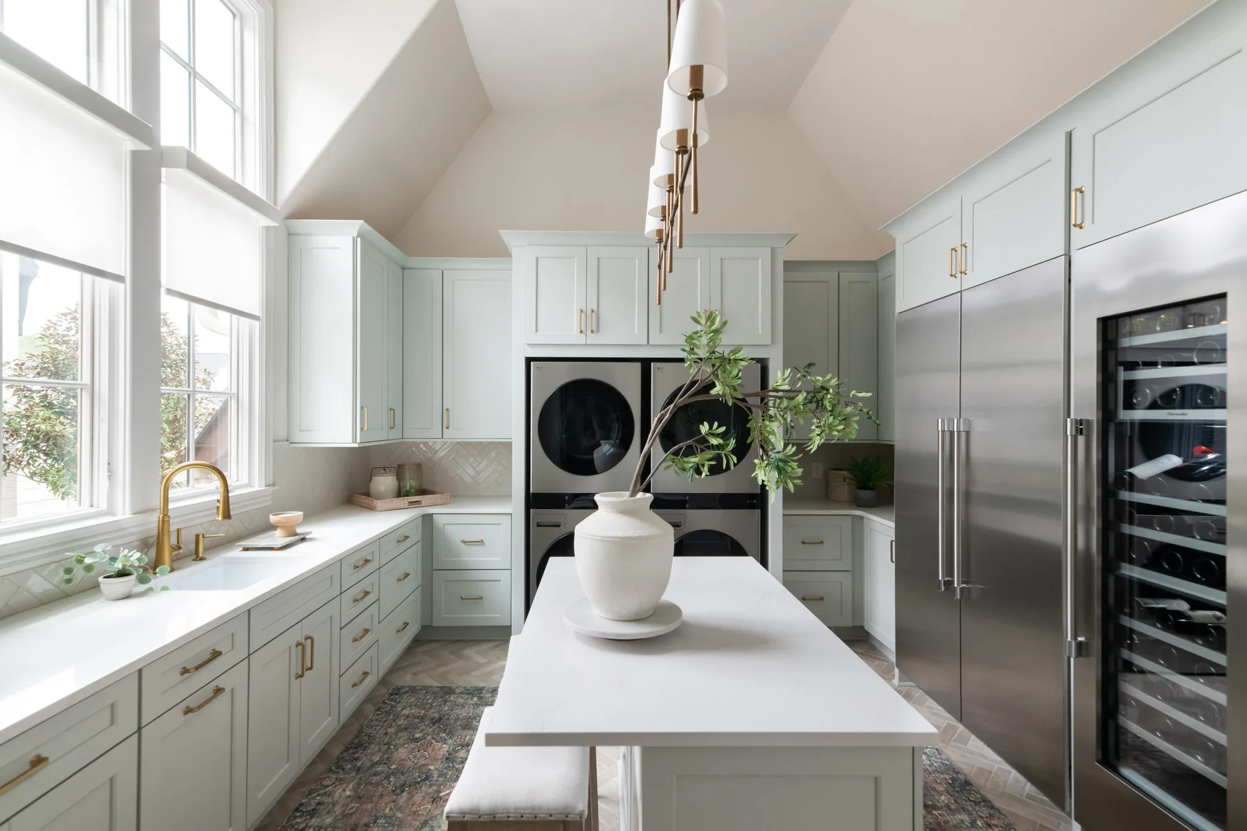Soft green kitchen with marble island styled by Shelter + Sanctuary